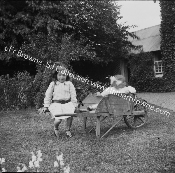 TRACTON HOUSE CHILDREN WITH WHEELBARROW